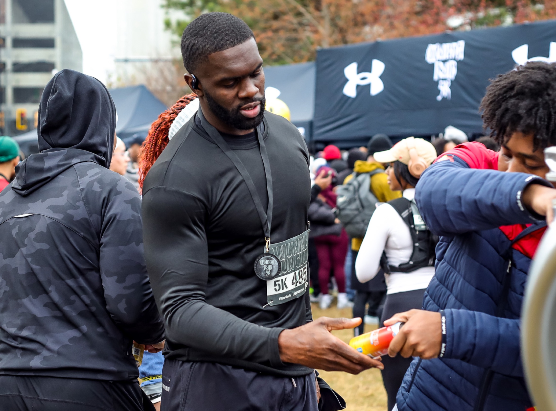 run club finish — cans handed to finishers