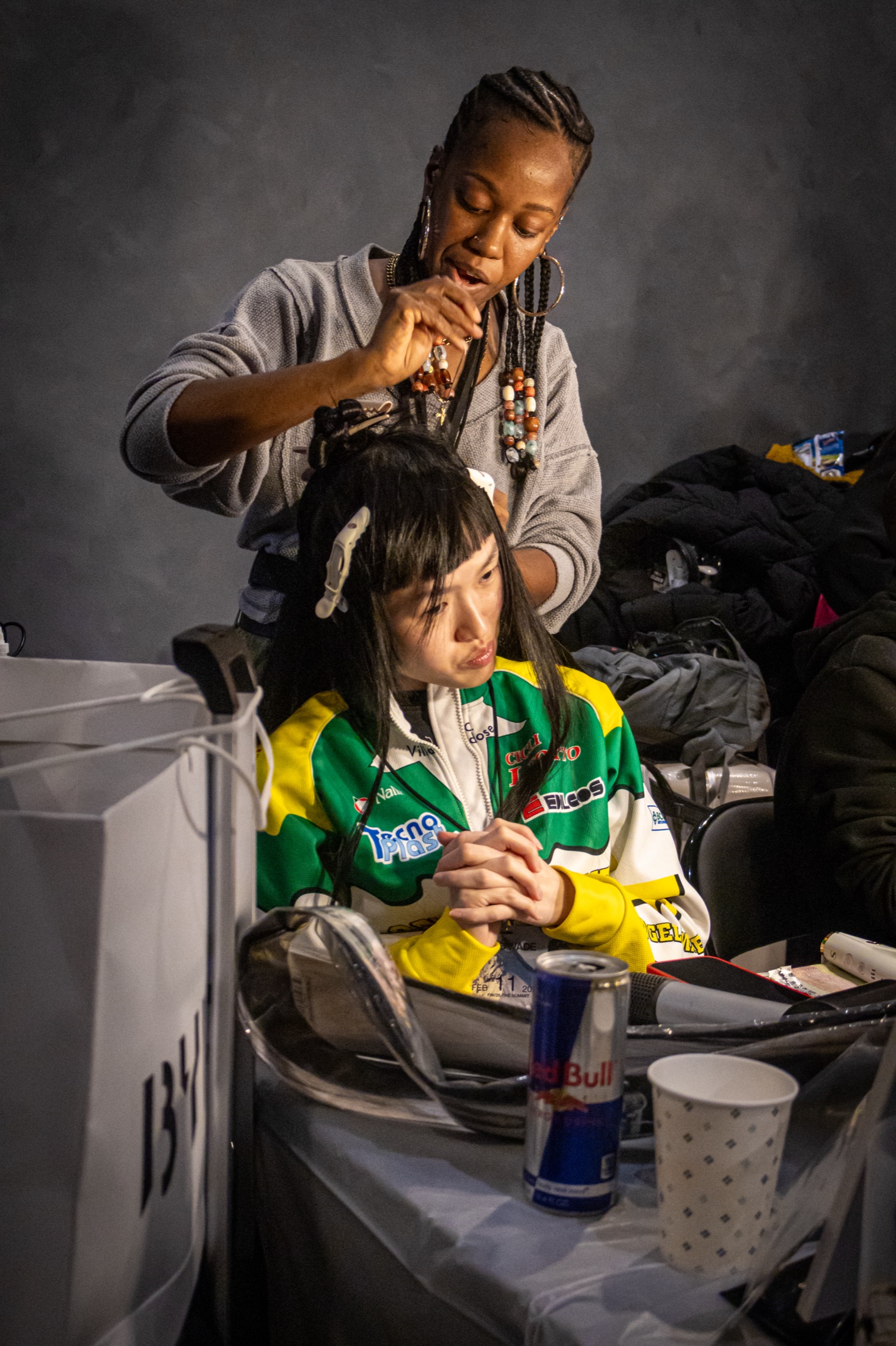 backstage — hair, call sheet, can on the table